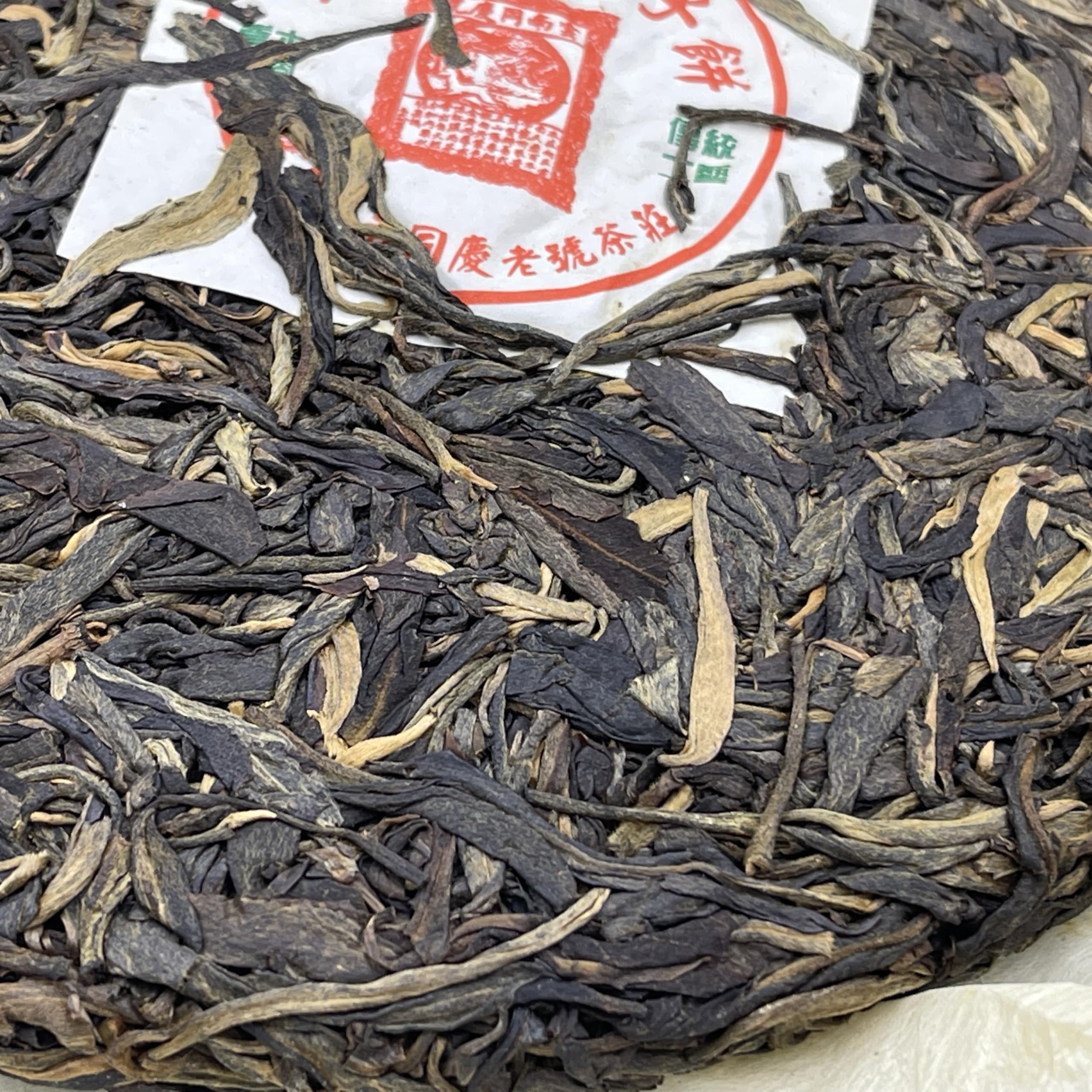 Yiwu Tongqing Hao Qiaomu Ancient Tree Raw Pu-Erh Tea 2003 – 357g